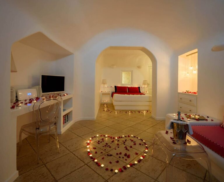 Cave suite with an arched ceiling and double bed at Above Blue Suites, Imerovigli, Santorini
