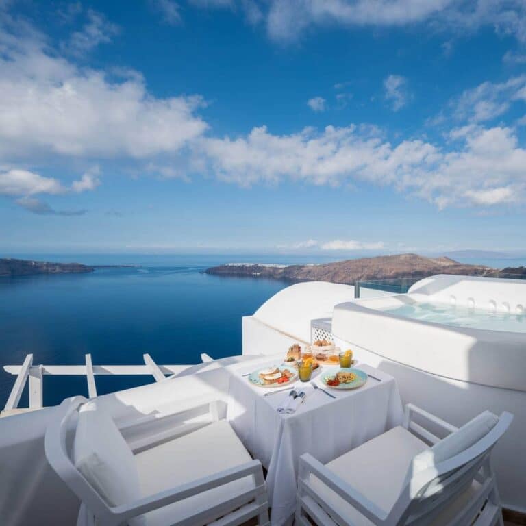 Breakfast laid out on a private terrace above the caldera at Above Blue Suites, Imerovigli, Santorini