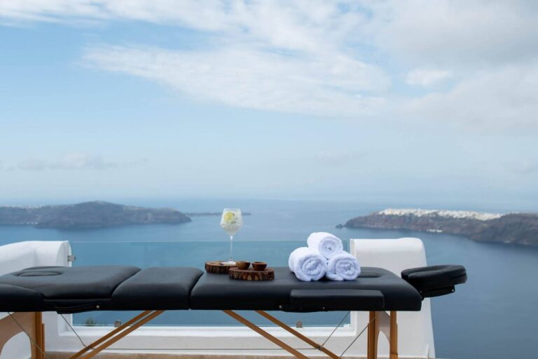 Massage table set up on a terrace overlooking the caldera at Above Blue Suites, Imerovigli, Santorini