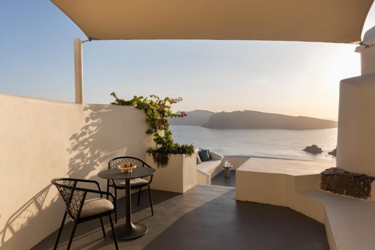 Terrace with a bistro table at sunset over the caldera at Canaves Oia Suites, Oia, Santorini