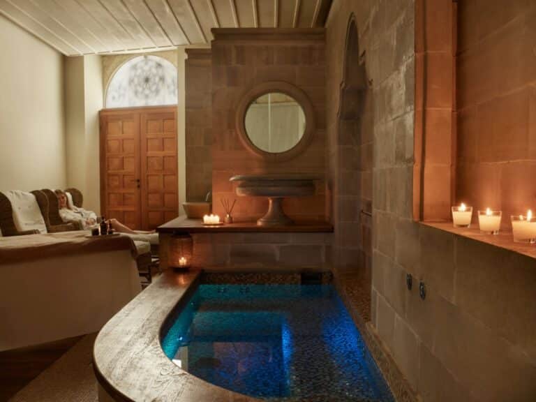 Candlelit spa pool beneath stone arches at Casa Delfino, Chania, Crete