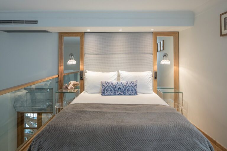 Split-level bedroom with a glass balustrade at Casa Delfino, Chania, Crete