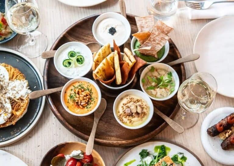 Spread of Greek mezze dishes at Cavo Tagoo, Mykonos