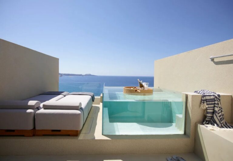 Glass-sided plunge pool on a sea-view terrace at Domes White Coast, Mytakas, Milos