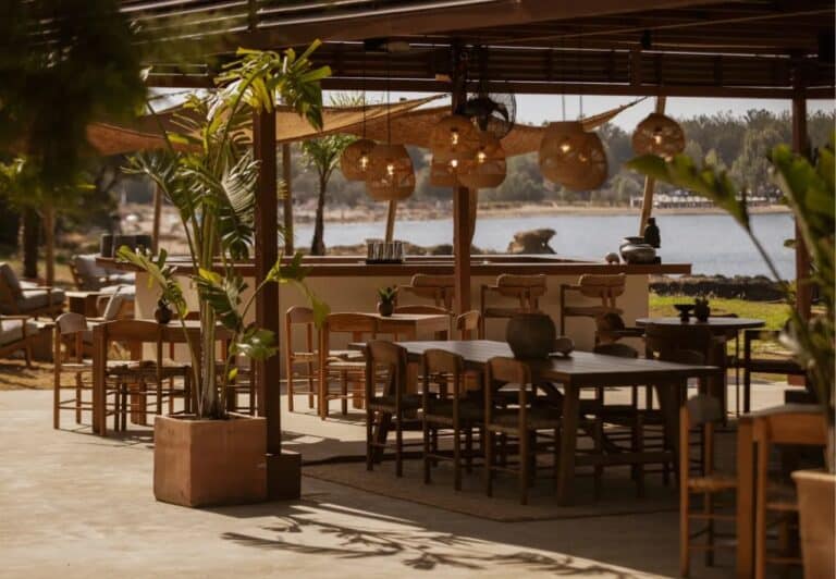 Restaurant terrace under rattan lanterns by the sea at Domes Zeen Chania, Crete