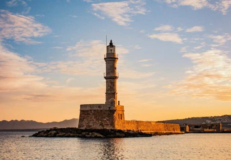 Venetian lighthouse in Chania harbour at sunset, a short drive from Domes Zeen Chania, Crete