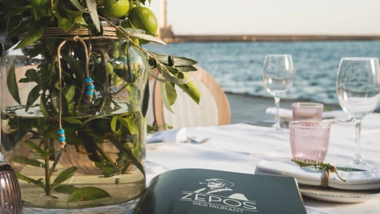 Table laid by the water with olive branches at Domus Renier, Chania, Crete